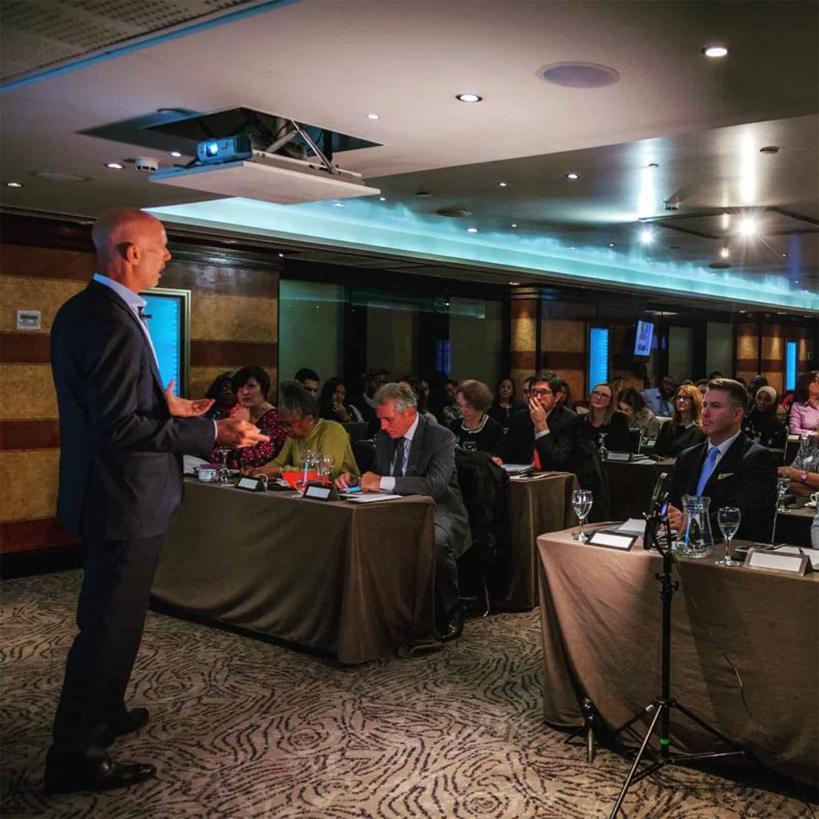 Charlie Dombek delivering a wealth strategy presentation to financial professionals